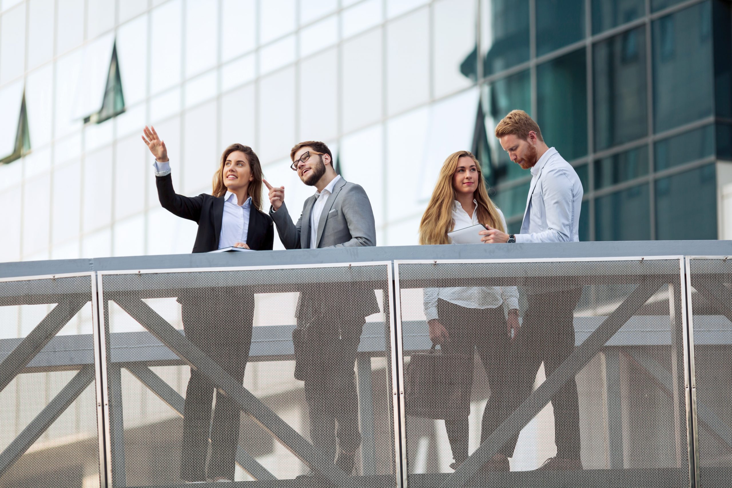 Smiling businesspeople brainstorming on a glass wall in an offic Asset Recovery in Healthcare